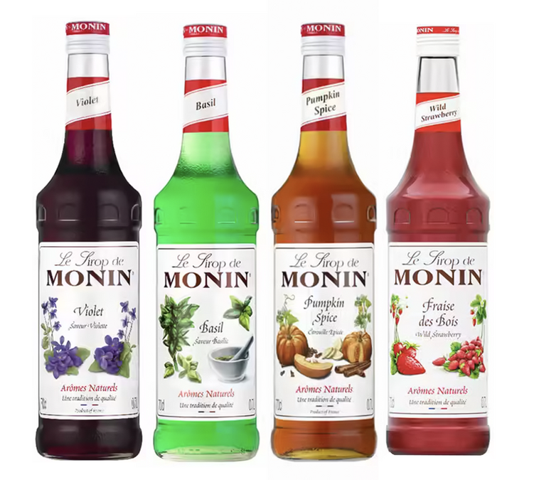Förpackning med 4 Monin-siraper: Basilika / Skogshallon / Violett / Pumpakrydda – 4 x 70 cl.
